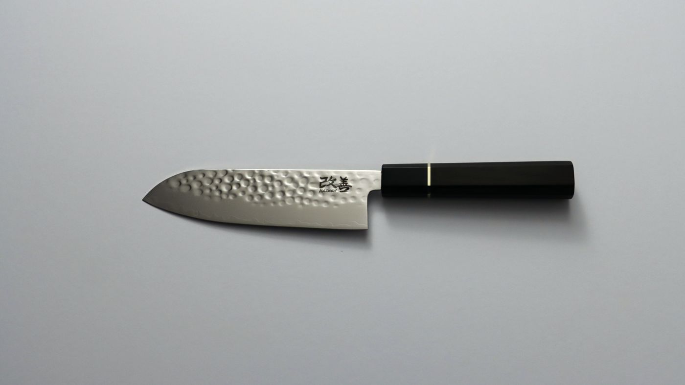 Kaizen santoku knife with hammered damascus blade and octagonal ebony handle with brass ring